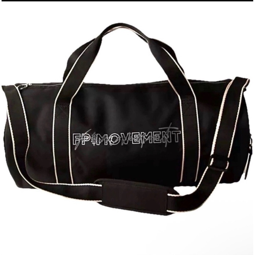 B38. FP Movement Free People Black Barrel Duffel Bag Gym Travel Logo Contrast